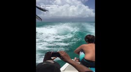 KID Watches DOLPHIN SURF Behind Boat