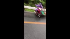 Motorcycle riders crash on slippery hill