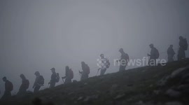 Sudents climbing through the peak of Olympus