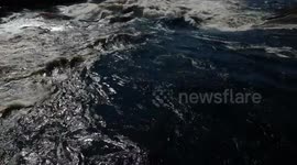 Whitewater Raft flips completely upside down in a HUGE wave.