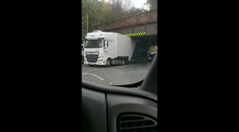 Truck stock under a low bridge