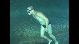 A world-twisting walk underwater