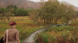 Walking through leaves autumn in Lake District, UK