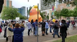 Protestors gather around Trump baby blimp outside Republican rally in Houston