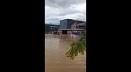 Locals use boat to rescue tractor from Trinidad and Tobago floods