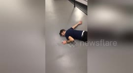 Knackered man takes a tumble down the stairs after heavy night out
