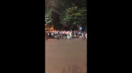 The girl performing shakes 100 iron-circles on the street