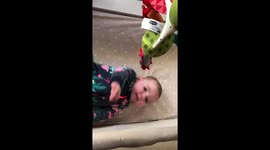 Playing with baby mobile