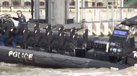 Metropolitan Police boat makes a u-turn on the river Thames