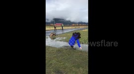 Girl takes spectacular fall in muddy puddle