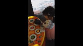 adorable girl play the whack-a-mole from slow to the crazy way.