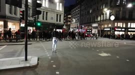 RAW: Eccentric man with megaphone shouts at jay-walkers in London