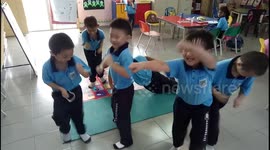 Adorable Kids Exercising in Classroom
