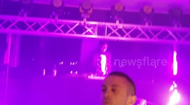 Lady puts fire sticks in mouth during Hollaween party Australia