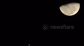 UFO leaves casts a shadow over the moon.