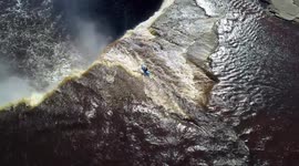 MUTE: Incredible drone footage shows kayaker going off 110ft waterfall