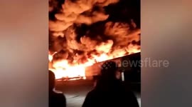 Dramatic footage shows roaring flames and massive smoke flumes as warehouse catches fire in northeast Chinese city