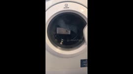 Moment iPhone spotted spinning in washing machine mid-cycle