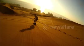 Daredevils go sandboarding across giant dunes in Chile