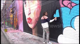 Graffiti artists brighten up industrial zone in Bogota with colourful murals