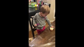 Dog and toddler share ice cream