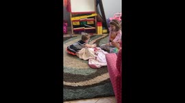 Baby upset with sisters helping her