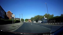 Oncoming yellow van driver turn right in front of me, at a busy crossroads