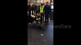 London commuters subdue man after hammer attack