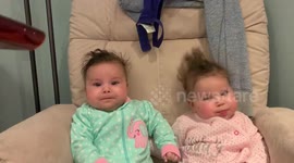 Indentical twin babies getting a blow dry