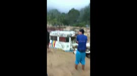 Dozens trapped in landslide after Typhoon Yutu ravages northern Philippines