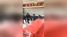Chinese seniors race through supermarket to grab groceries