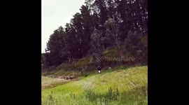 KTM 350 EXC jumping over friends