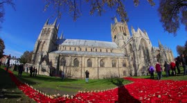 Knitted Poppies being installed on one of the towers at Selby Abbey