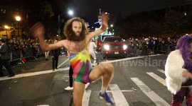 Man in woman’s bathing suit performs striptease dance at NYC Halloween parade