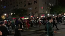 Costumed dancers move to the tune of 'Thriller' at NYC Village Halloween Parade