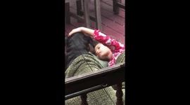 Too cute! Little girl sings sweetly to family dog
