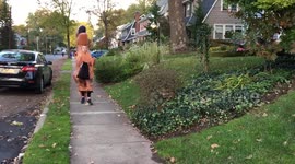 Halloween Dinosaur girl trick-or-treating