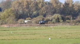 Small helicopter practising manoeuvres at Shoreham Airport