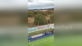 Fan chucked out of Falkirk stadium climbs tree to watch game