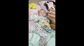 Funny Baby kept kicking his legs when he seeing himself on Phone Screen