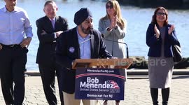 Sen. Cory Booker hugs and lifts Hoboken Mayor Ravinder Bhalla at Menedez Rally