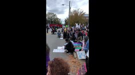 Protestors take a knee as national anthem plays outside Chattanooga Republican rally