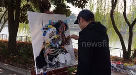 Chinese artist uses cleaver and scraper to create oil painting