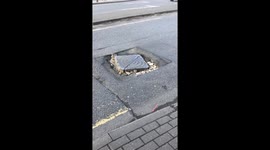 'Hole' lot of shaking going on in square pothole