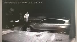 Thugs covering BMW with a Fire Extingusher