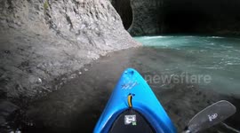 kayaker runs infamous waterfall Salto Leona deep down in a volcanic gorge