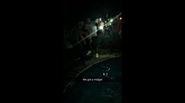 2 grown men throw midget in pool