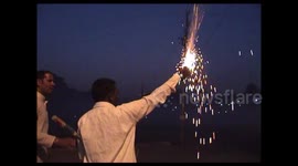 Indian villagers hurl lit firecracker at each other during spiritual war games