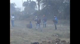 Indian villagers risking their lives as they attack each other with firecracker missiles during spiritual war games