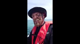 In your face! Funny moment Aussie fisherman gets inked by slippery squid